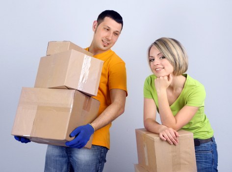 Removal van and movers preparing for scheduled delivery