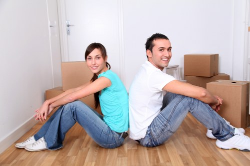 Heavy furniture being safely carried through a Knightsbridge building