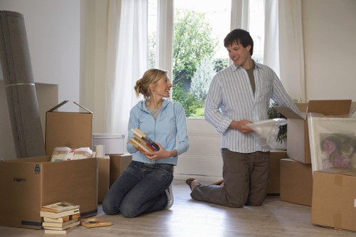 Professional movers handling office furniture during a central London move