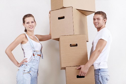 Removalists safely carrying boxes through a Knightsbridge apartment building